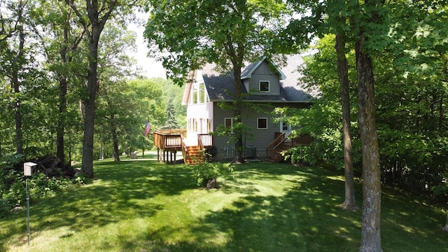 32813 Whispering Springs Loop, Erhard, MN 56534 - view of grassy yard featuring stairs and a deck