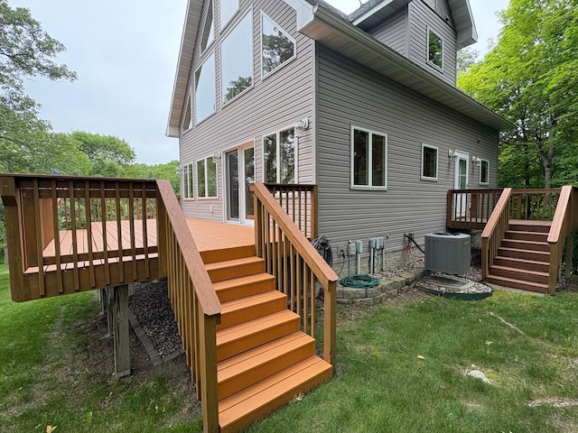 32813 Whispering Springs Loop, Erhard, MN 56534 - rear view of property with stairway, a wooden deck, and a yard