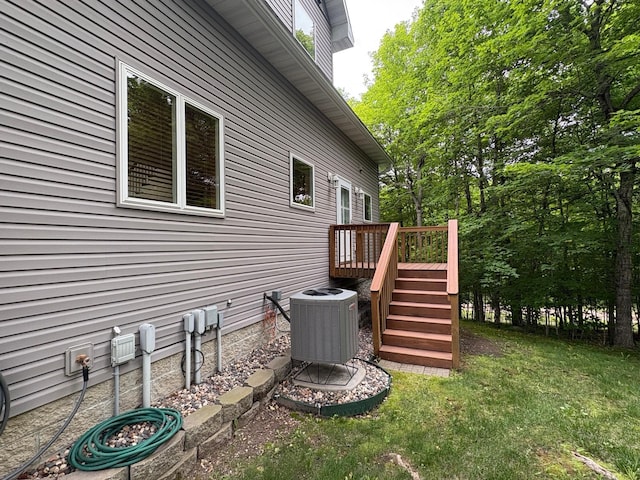 32813 Whispering Springs Loop, Erhard, MN 56534 - view of side of property featuring a deck, stairs, and a lawn
