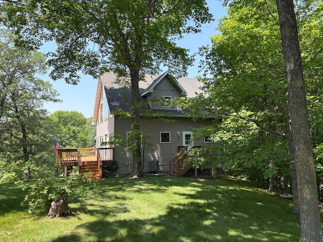 32813 Whispering Springs Loop, Erhard, MN 56534 - rear view of house with stairway, a wooden deck, a lawn, and roof with shingles