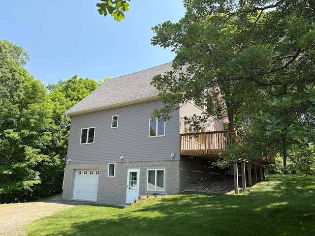 32813 Whispering Springs Loop, Erhard, MN 56534 - rear view of property with driveway, a garage, a deck, and a yard