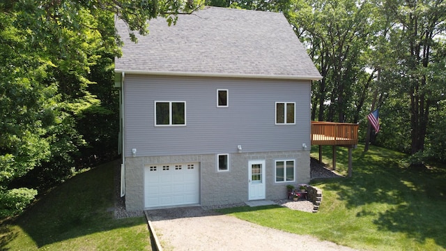 32813 Whispering Springs Loop, Erhard, MN 56534 - view of side of home featuring driveway, an attached garage, a yard, a wooden deck, and roof with shingles