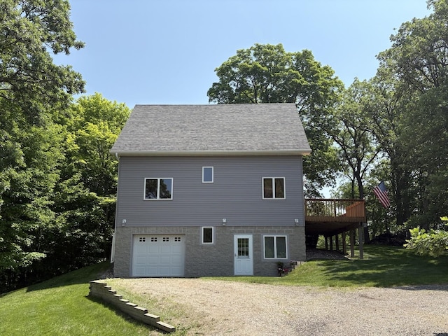 32813 Whispering Springs Loop, Erhard, MN 56534 - view of home's exterior with an attached garage, dirt driveway, a yard, and a deck