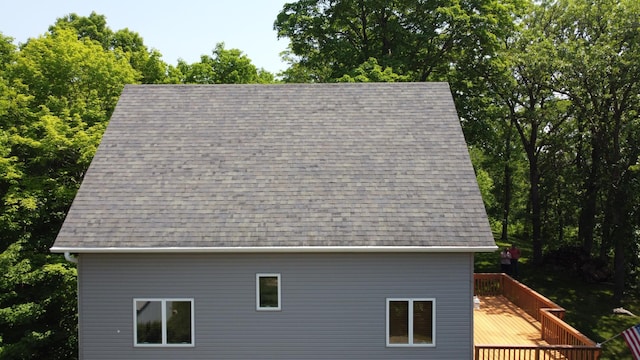 32813 Whispering Springs Loop, Erhard, MN 56534 - exterior view of a shingled roof, a downspout, and gutters