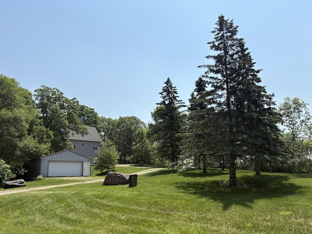 32813 Whispering Springs Loop, Erhard, MN 56534 - view of grassy yard with an outdoor structure and a detached garage