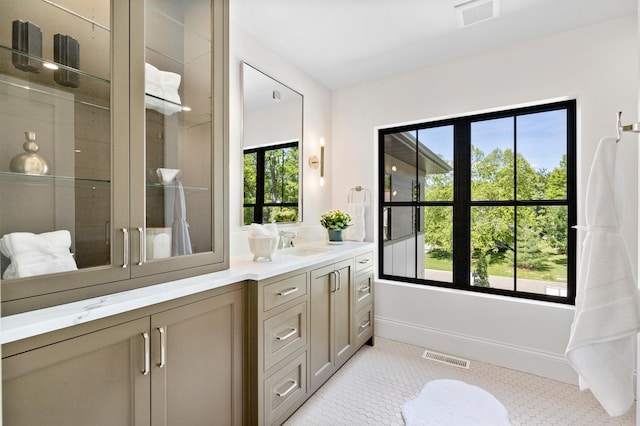 55XX Mcguire Rd, Edina, MN 55439 - full bath featuring double vanity, a shower, and tile patterned floors