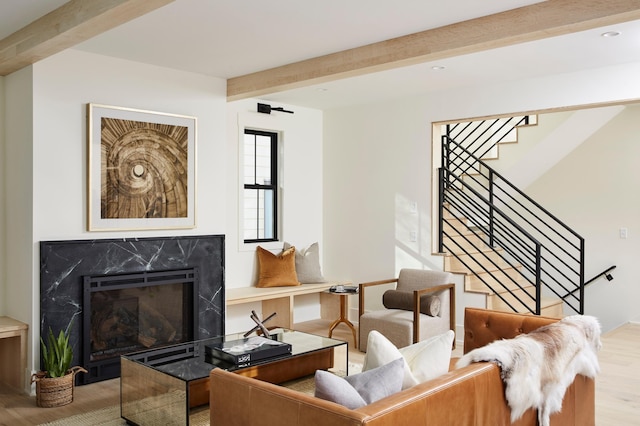 55XX Mcguire Rd, Edina, MN 55439 - living area with beamed ceiling, stairway, wood finished floors, and a premium fireplace