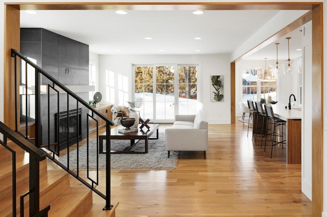 55XX Mcguire Rd, Edina, MN 55439 - living area featuring light wood finished floors, stairway, and recessed lighting