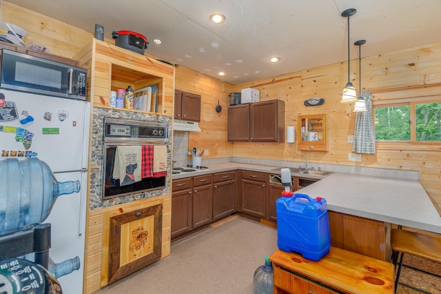 6076 Wynne Ridge Rd, White Twp, MN 55705 - kitchen with white appliances, light countertops, a sink, pendant lighting, and recessed lighting