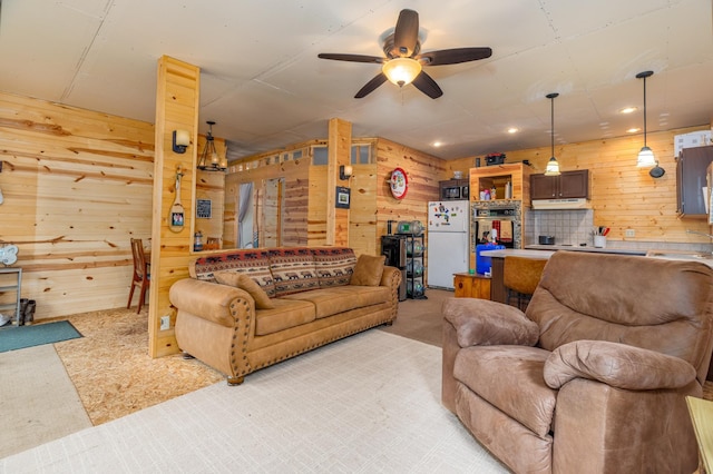 6076 Wynne Ridge Rd, White Twp, MN 55705 - living room with wood walls, a ceiling fan, light carpet, and recessed lighting