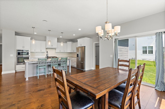 15827 Ethan Trl N, Hugo, MN 55038 - dining room with a chandelier, dark wood-style flooring, and recessed lighting