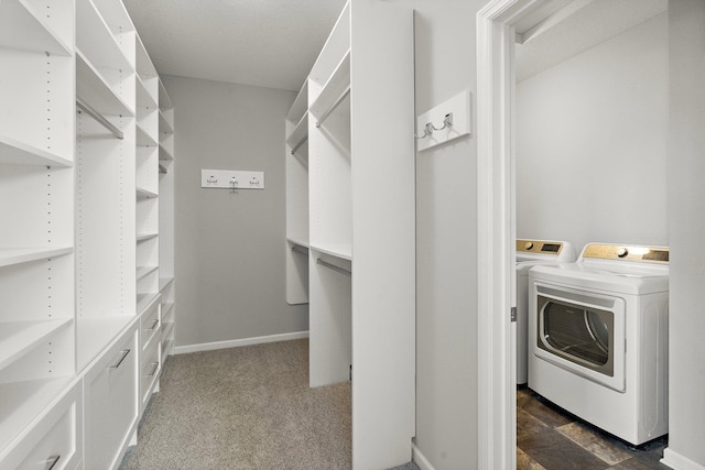 15827 Ethan Trl N, Hugo, MN 55038 - spacious closet featuring washer / clothes dryer and dark carpet