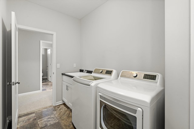 15827 Ethan Trl N, Hugo, MN 55038 - washroom featuring independent washer and dryer, cabinet space, baseboards, and dark stone finish flooring