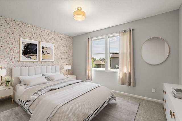 15827 Ethan Trl N, Hugo, MN 55038 - carpeted bedroom with wallpapered walls, baseboards, and an accent wall