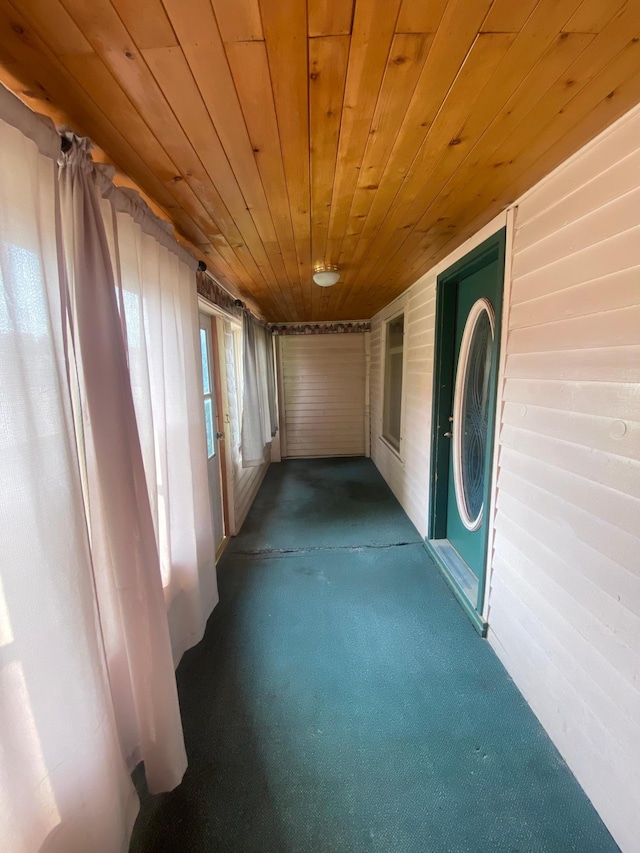 8 Dayton Ave SE, Wadena, MN 56482 - hall with wooden ceiling, carpet flooring, and wood walls