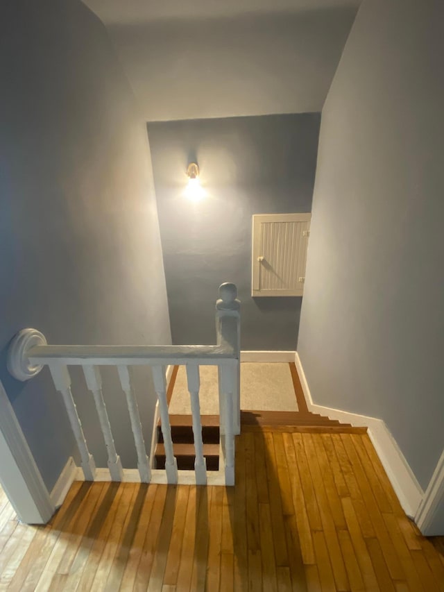 8 Dayton Ave SE, Wadena, MN 56482 - staircase with wood-type flooring and baseboards