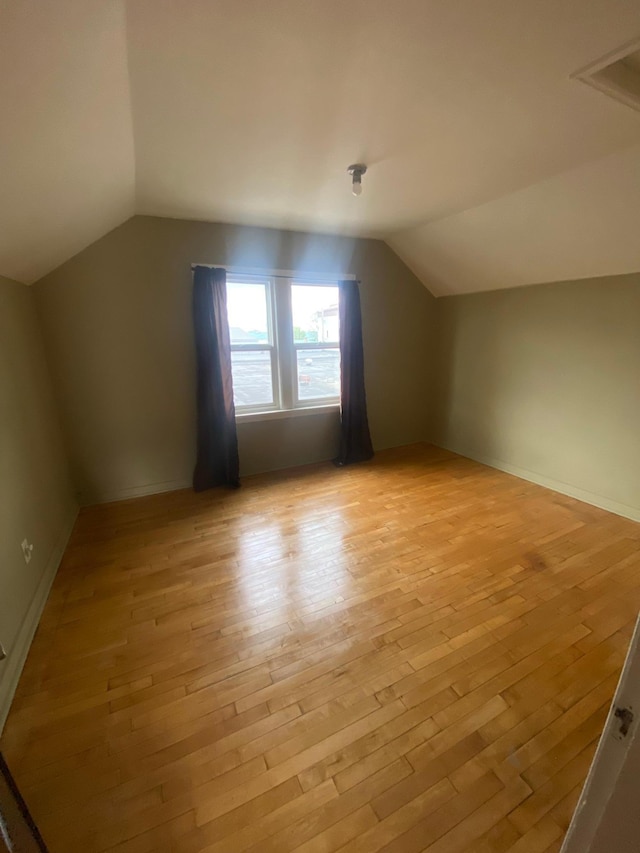 8 Dayton Ave SE, Wadena, MN 56482 - additional living space with vaulted ceiling and light wood-style flooring