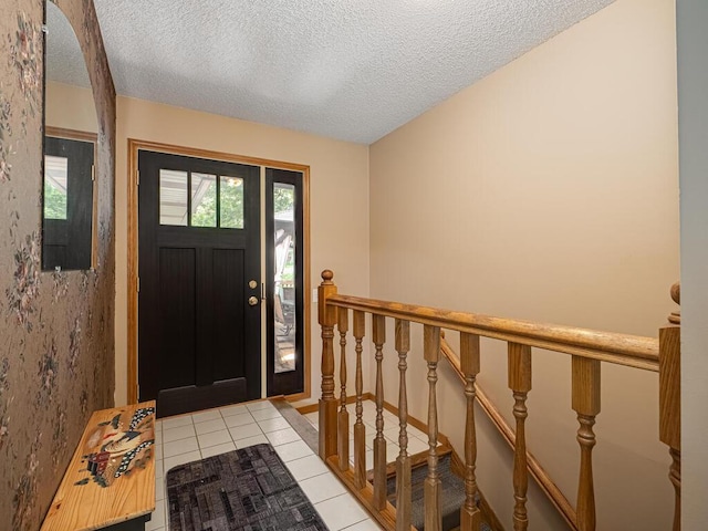 18241 Dahlia St NW, Oak Grove, MN 55011 - entrance foyer with light tile patterned floors and a textured ceiling