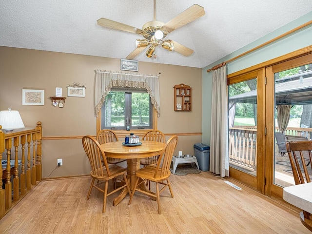 18241 Dahlia St NW, Oak Grove, MN 55011 - dining room featuring light wood finished floors, ceiling fan, and a textured ceiling