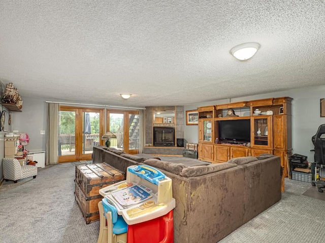 18241 Dahlia St NW, Oak Grove, MN 55011 - carpeted living area featuring a textured ceiling and a glass covered fireplace