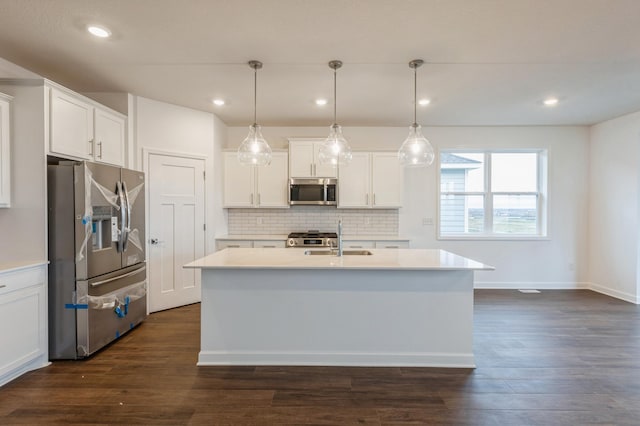 20119 68th Pl, Corcoran, MN 55340 - kitchen with stainless steel appliances, tasteful backsplash, white cabinetry, light countertops, and recessed lighting