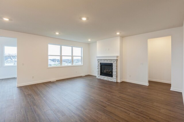 20119 68th Pl, Corcoran, MN 55340 - unfurnished living room with dark wood-style floors, a fireplace, and recessed lighting