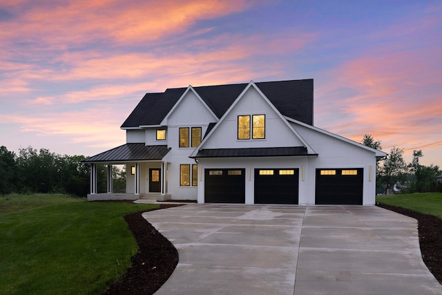 9743 Frontier Ln, Lakeville, MN 55044 - modern farmhouse style home featuring a standing seam roof, driveway, a yard, and an attached garage