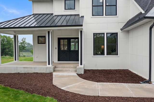 9743 Frontier Ln, Lakeville, MN 55044 - doorway to property with a standing seam roof, a metal roof, and roof with shingles