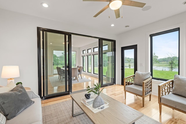 9743 Frontier Ln, Lakeville, MN 55044 - living room featuring light wood-style flooring, healthy amount of natural light, ceiling fan, and recessed lighting