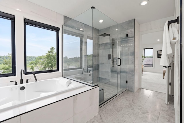 9743 Frontier Ln, Lakeville, MN 55044 - full bathroom featuring a bath, a stall shower, marble finish flooring, and recessed lighting