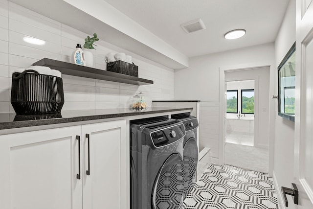 9743 Frontier Ln, Lakeville, MN 55044 - laundry area featuring independent washer and dryer and tile patterned floors