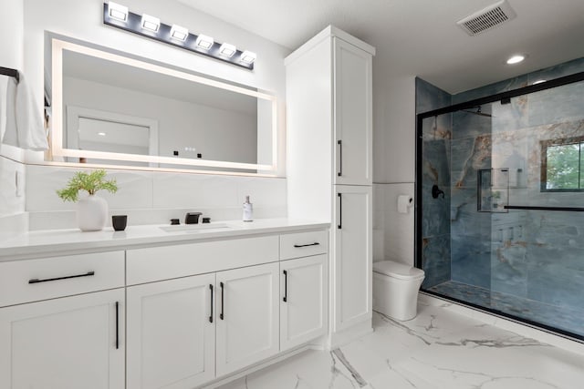 9743 Frontier Ln, Lakeville, MN 55044 - full bathroom with vanity, a marble finish shower, marble finish floors, and recessed lighting