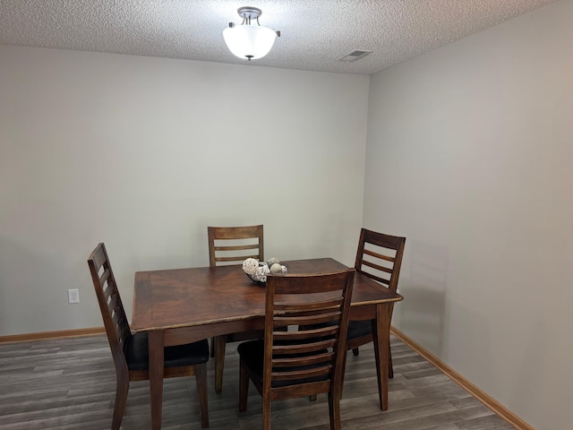 13622 Partridge Cir NW, Andover, MN 55304 - dining space featuring wood finished floors and a textured ceiling