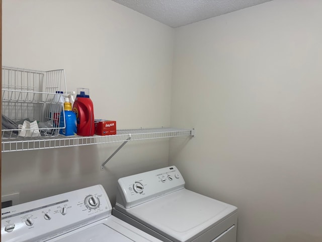 13622 Partridge Cir NW, Andover, MN 55304 - laundry room with washer and dryer and a textured ceiling