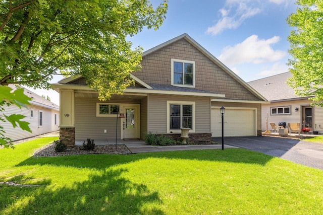 98 Tribute Ave, Hudson, WI 54016 - view of front facade featuring asphalt driveway and a front yard