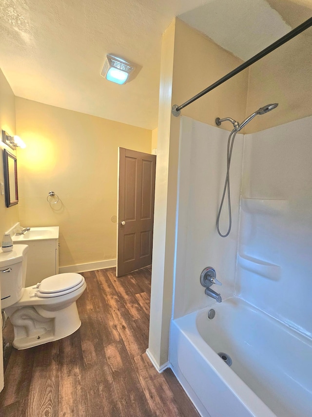 324 Holcombe Ave, Litchfield, MN 55355 - bathroom with wood finished floors, vanity, and shower / bathtub combination
