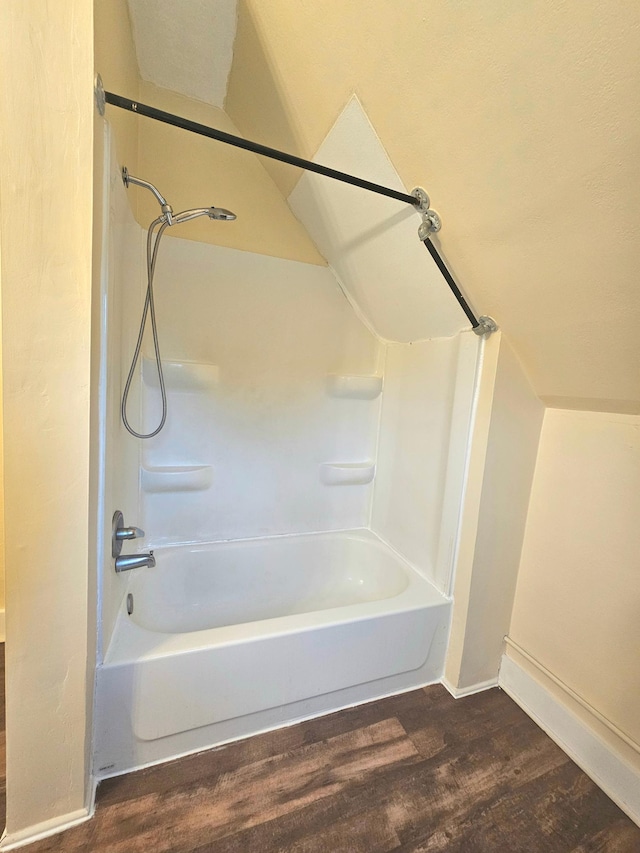 324 Holcombe Ave, Litchfield, MN 55355 - full bathroom featuring wood finished floors and shower / tub combination