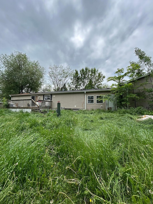 12183 120th St, Milo Twp, MN 56353 - back of house featuring a deck