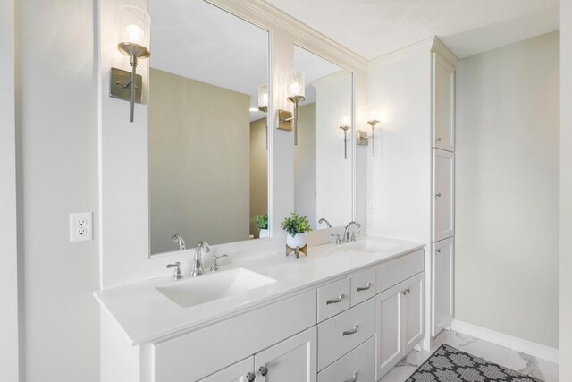 1149 167th Ave NW, Andover, MN 55304 - bathroom featuring marble look tiles, double vanity, and baseboards