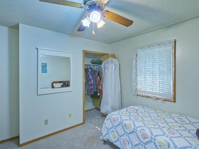 638 Shady Creek Cir, Winsted, MN 55395 - carpeted bedroom with a closet, a textured ceiling, a spacious closet, and ceiling fan