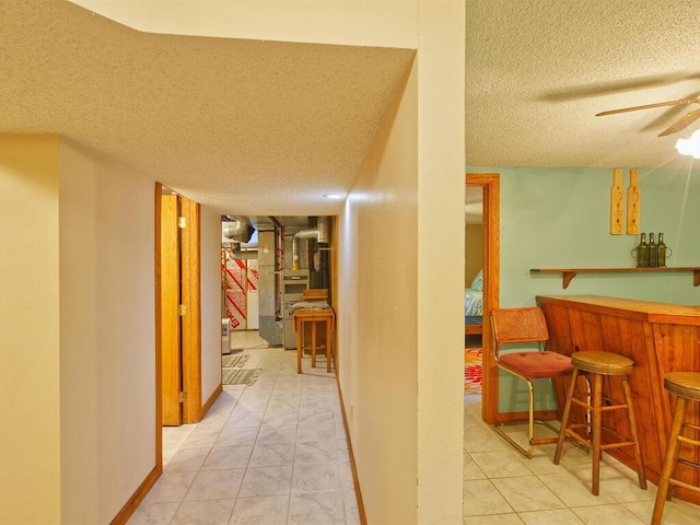 638 Shady Creek Cir, Winsted, MN 55395 - hall with a textured ceiling, tile patterned flooring, and heating unit
