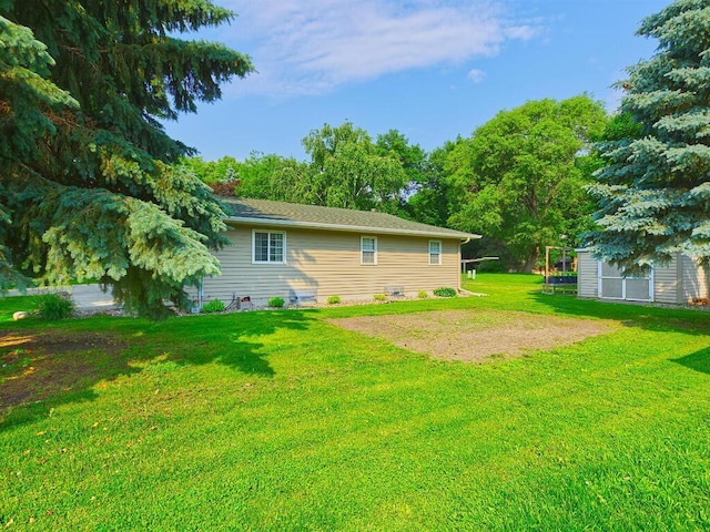 638 Shady Creek Cir, Winsted, MN 55395 - rear view of house with a lawn and an outdoor structure