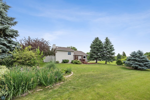 3306 26th Ave S, Fargo, ND 58103 - view of grassy yard with a wooden deck