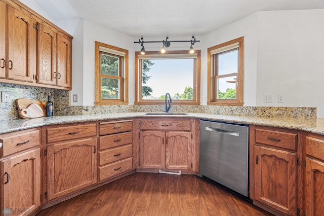 3306 26th Ave S, Fargo, ND 58103 - kitchen featuring dishwasher, dark wood-style floors, tasteful backsplash, light stone counters, and brown cabinets