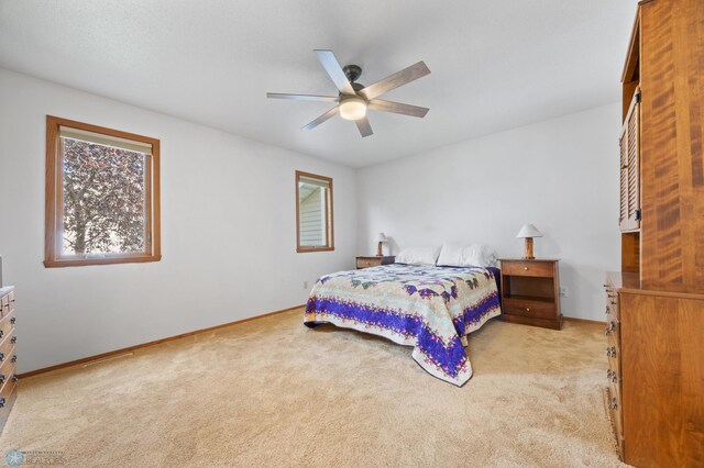 3306 26th Ave S, Fargo, ND 58103 - bedroom with light colored carpet and a ceiling fan