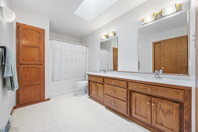 3306 26th Ave S, Fargo, ND 58103 - bathroom with a skylight, double vanity, shower / bath combo, and a baseboard heating unit