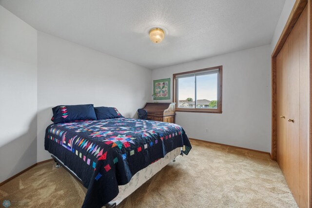 3306 26th Ave S, Fargo, ND 58103 - carpeted bedroom featuring baseboards and a textured ceiling