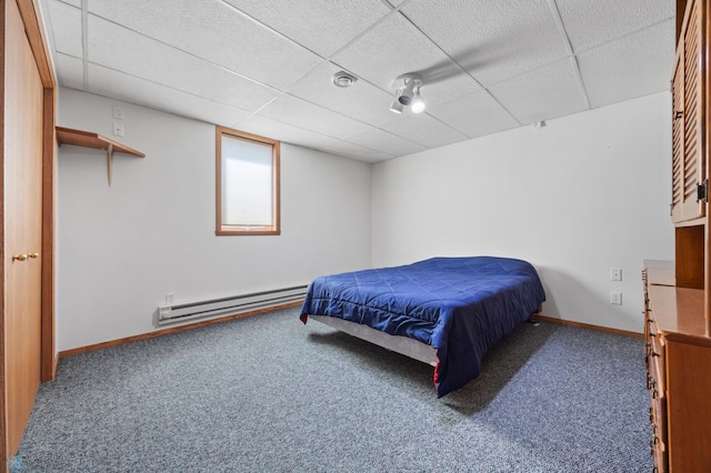 3306 26th Ave S, Fargo, ND 58103 - bedroom with a baseboard heating unit, carpet flooring, and a paneled ceiling