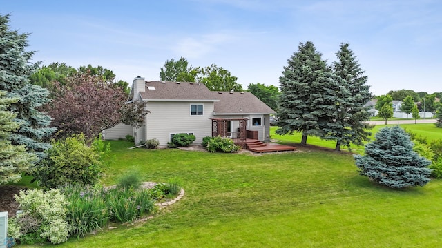 3306 26th Ave S, Fargo, ND 58103 - back of property featuring a deck, a lawn, and a chimney