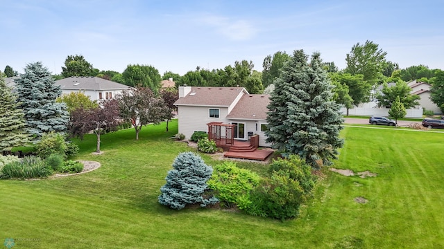 3306 26th Ave S, Fargo, ND 58103 - rear view of house with a deck, a yard, and a chimney